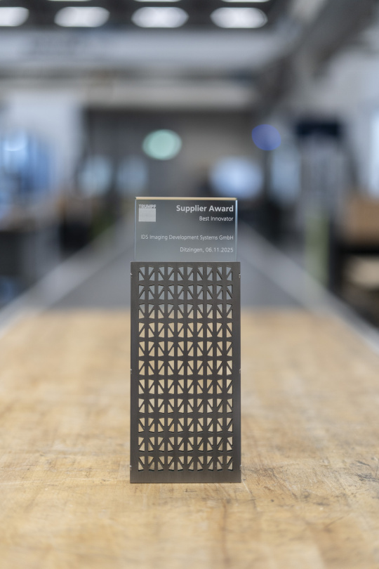 TRUMPF Supplier Award Best Innovator for IDS Imaging Development Systems GmbH – modern award on a wooden table, symbol of innovation