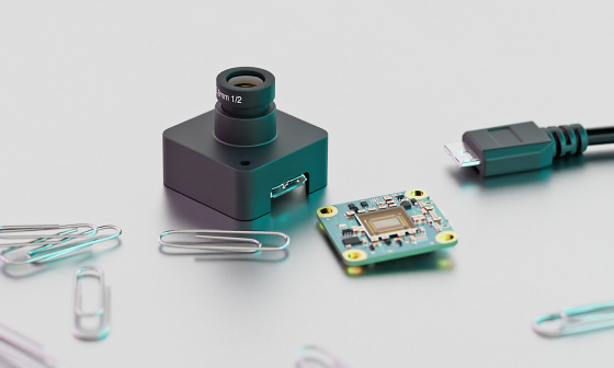 IDS event-based camera in size comparison with paper clips