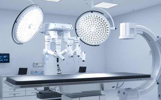 White room with technical medical equipment facing the couch.