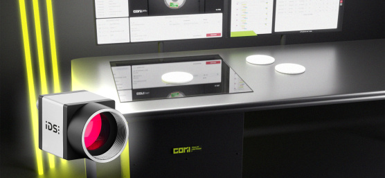 COMI Label Reader as a desktop scanner, with three yellow light bars on the left and an uEye camera in front