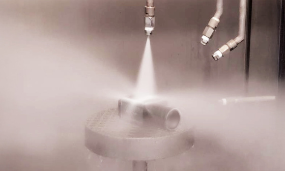 Industrial camera is exposed to powerful water jets from all sides in spray system