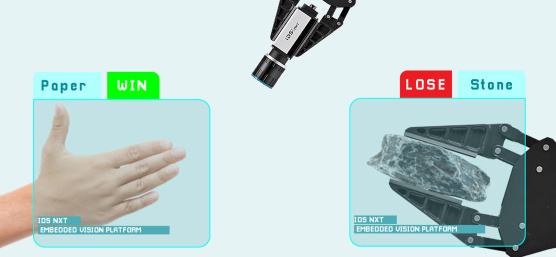 An IDS camera detects a hand and a gripper and shows who has won.