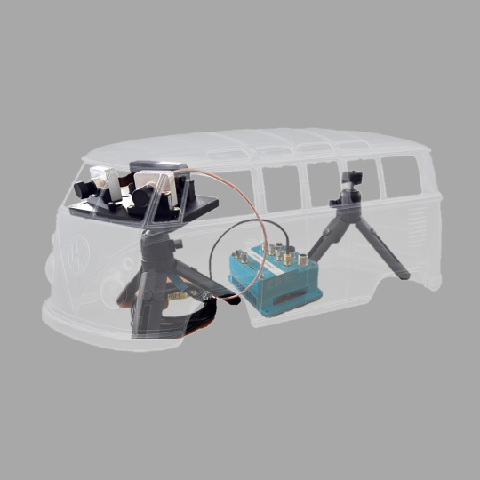 Camera setup on tripods overlaid with transparent vehicle outline