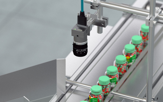 IDS camera inspects medication packaging on conveyor belt.