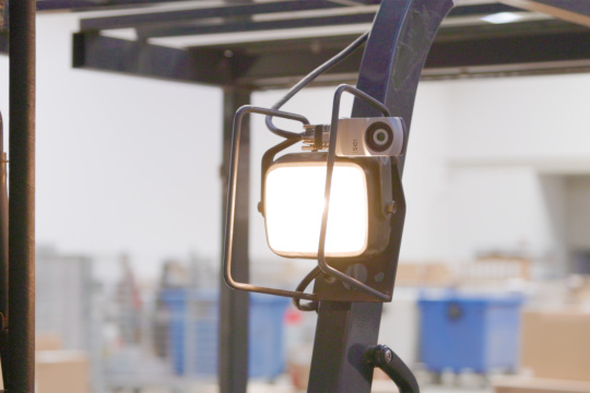 uEye XC mounted on the front pillar of a forklift above a lamp.