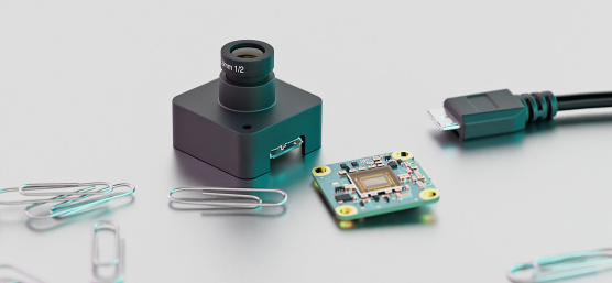 IDS event-based camera in size comparison with paper clips