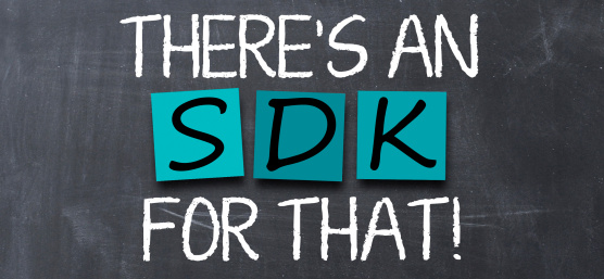 A white chalkboard with turquoise Post-Its reading S D K is written on a gray board.