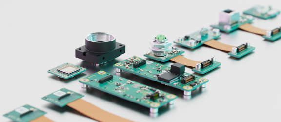 Components of a uEye ACP industrial camera arranged side by side