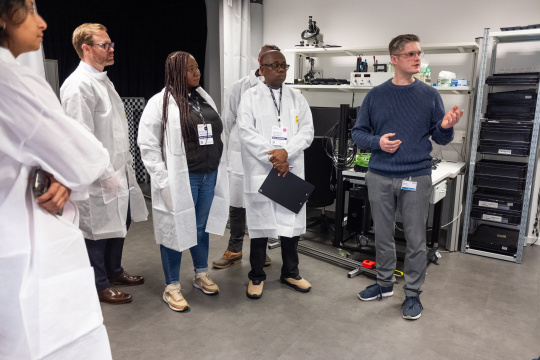 MIT REAP delegation visiting the IDS optics laboratory.