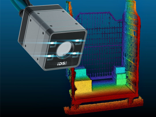 A 3D camera captures a color-coded point cloud of a loaded roll container.