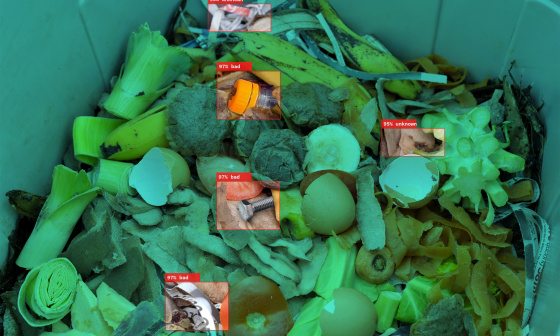 IDS industrial cameras detect plastic waste as foreign matter between organic waste in an open container.