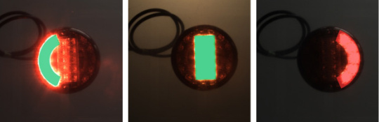 3 images of a multi-chamber vehicle lamp with one green or red light enabled in each case