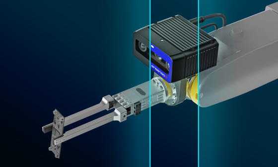 A gripper with Ensenso B 3D camera holds a circuit board