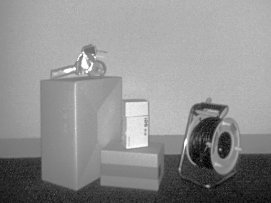 Gray intensity image from the Nion 3D camera shows various objects in front of a wall.