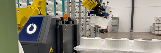 Installation of large rolls with a robot.
