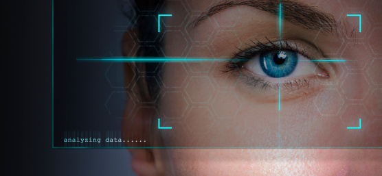 Human eye in the field of view of a camera with text "analyzing data".