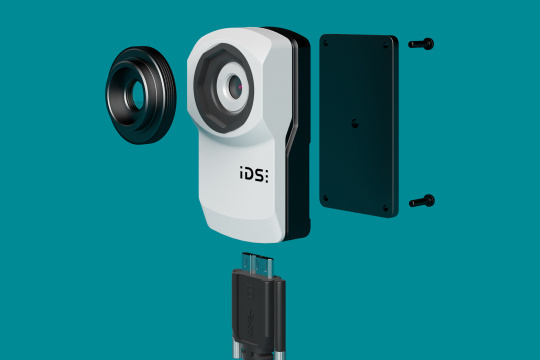 The uEye XC kit disassembled into camera, mount, lens and cable