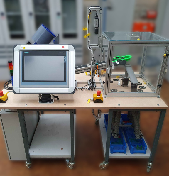 Experimental setup of a clamping bricks sorting machine with IDS camera and screen