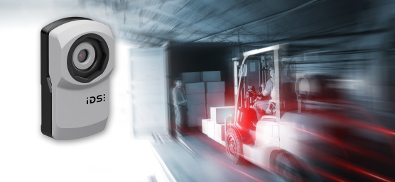 uEye XC camera hovers next to a dynamic scene with a forklift and truck.