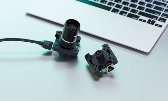 2 uEye SLE single-board cameras with different optics in front of laptop keyboard