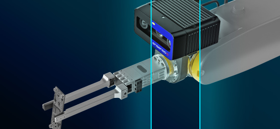 A gripper with Ensenso B 3D camera holds a circuit board
