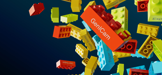Colorful Lego bricks with lettering loose in front of dark background.