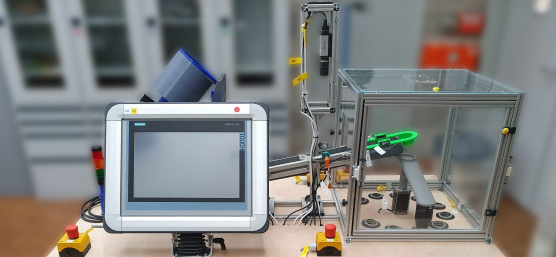Experimental setup of a clamping bricks sorting machine with IDS camera and screen